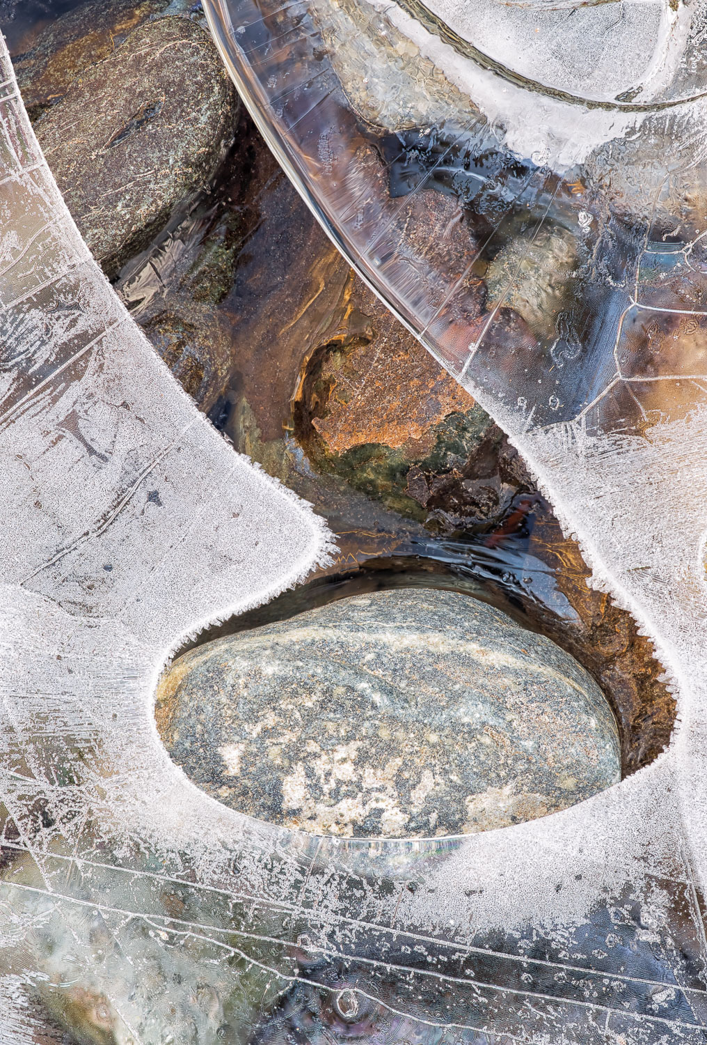 Ice formation along the edge of a stream in winter.  Image #1754